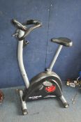 AN OLYMPUS SPORT OS-10201 PACE EXERCISE BIKE with digital read out