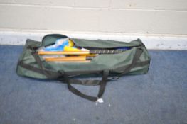 A GREEN BAG CONTAINING A LONGWORTH CROQUET SET