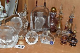 A COLLECTION OF GLASS SCULPTURES AND SCENT BOTTLES, comprising three Mats Jonasson relief glass