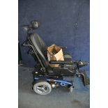 A PRIDE MOBILITY ARTEMIS ELECTRIC WHEELCHAIR with headrest, two footrests, charger and manual (PAT