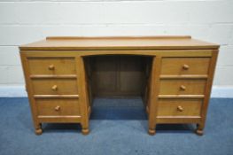 MOUSEMAN, A ROBERT THOMPSON OF KILBURN ENGLISH OAK PANELLED KNEE HOLE DESK, with an adzed top, and