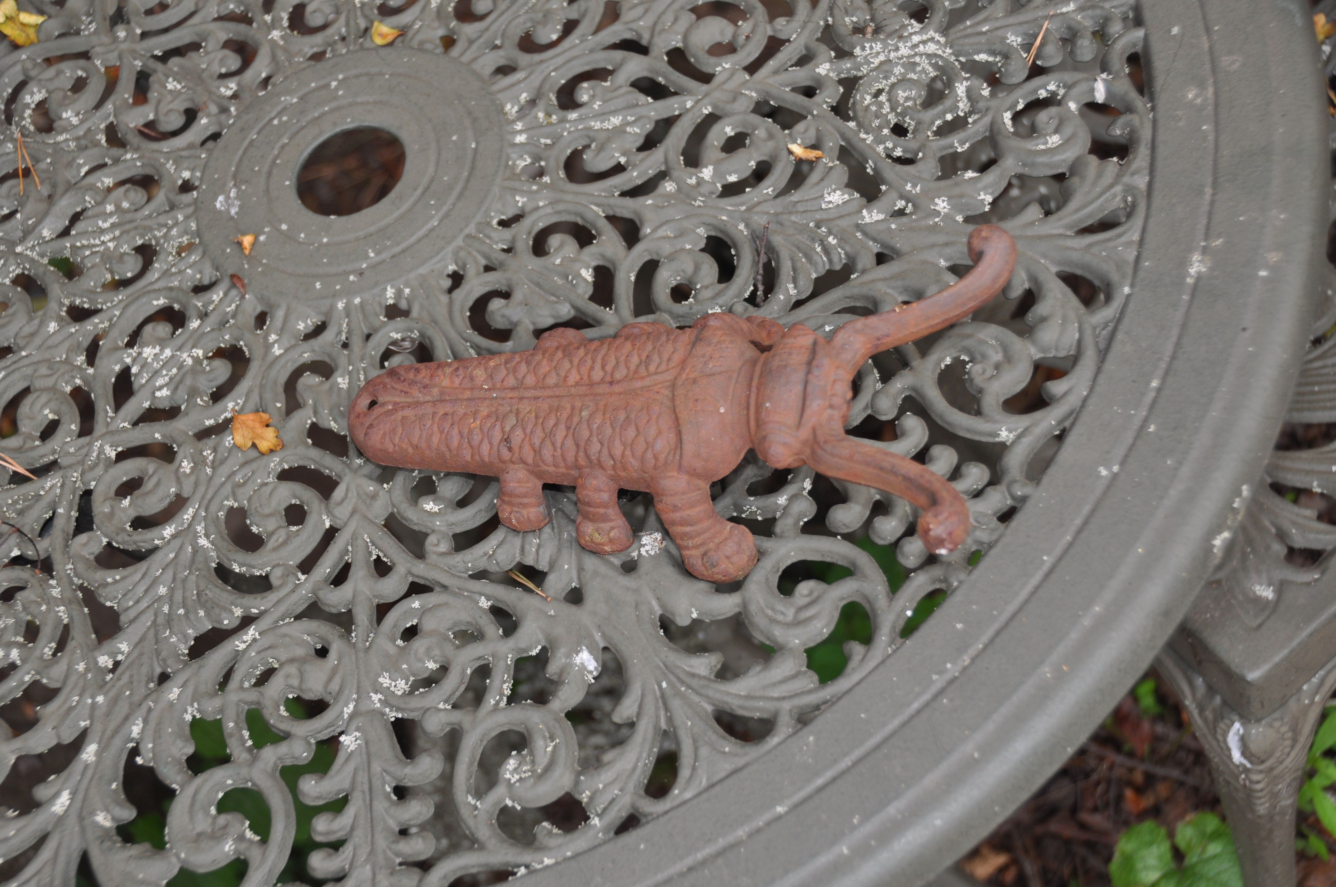 A MODERN CIRCULAR CAST ALUMINIUM GARDEN TABLE 69cm in diameter with two matching chairs, a Scarab - Image 3 of 5