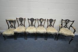 AN EDWARDIAN MAHOGANY PARTIAL SALON SUITE, comprising an open armchair, a set of four chairs, and