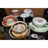 A GROUP OF SIX CHINA CUPS AND SAUCERS, comprising a Paragon cup and saucer pattern A1153,