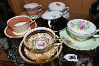 A GROUP OF SIX CHINA CUPS AND SAUCERS, comprising a Paragon cup and saucer pattern A1153,