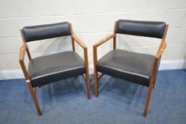 A PAIR OF MID CENTURY TEAK ARMCHAIRS, with black leatherette back and seat (condition report: