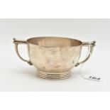A GEORGE VI SILVER TWIN HANDLED PORRIDGE BOWL, with angular handles and ribbed foot, makers James