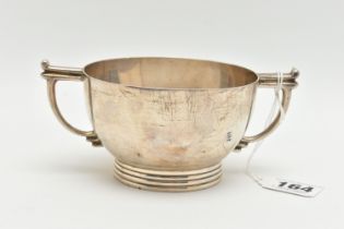 A GEORGE VI SILVER TWIN HANDLED PORRIDGE BOWL, with angular handles and ribbed foot, makers James