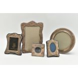 FIVE ASSORTED 20TH CENTURY SILVER MOUNTED EASEL BACK PHOTOGRAPH FRAMES, the largest a Britannia
