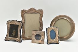 FIVE ASSORTED 20TH CENTURY SILVER MOUNTED EASEL BACK PHOTOGRAPH FRAMES, the largest a Britannia