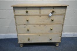 A VICTORIAN PINE CHEST OF TWO SHORT OVER THREE LONG DRAWERS, on turned feet, and later brass