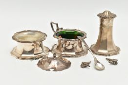 A THREE PIECE SILVER CONDIMENT SET, comprising of a mustard with green glass insert and broken
