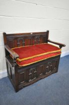 AN OAK PANELLED HALL SETTLE, with a loose seat cushion, length 97cm (condition report: surface