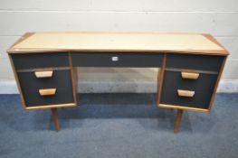 A MID CENTURY UNIFLEX STRIPPED AND RESTORED DRESSING TABLE, with black finish drawer fronts, on