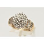 A DIAMOND CLUSTER RING, a yellow metal diamond cluster ring, tapered shoulders to a plain polished