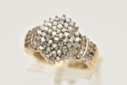 A DIAMOND CLUSTER RING, a yellow metal diamond cluster ring, tapered shoulders to a plain polished