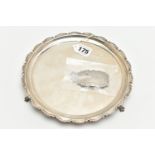 AN ELIZABETH II SILVER SALVER, circular form with scalloped detail, three scrolled feet,