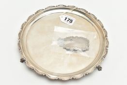 AN ELIZABETH II SILVER SALVER, circular form with scalloped detail, three scrolled feet,