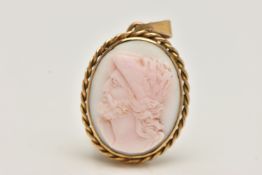 A CARVED CAMEO PENDANT, the oval conch shell carved to depict a male soldier in profile within a