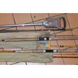 THREE VINTAGE FISHING RODS AND A SHOOTING STICK, comprising a cane rod by George Wilkins & Son