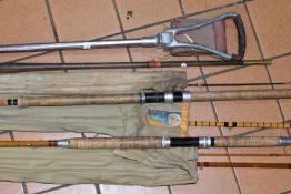 THREE VINTAGE FISHING RODS AND A SHOOTING STICK, comprising a cane rod by George Wilkins & Son