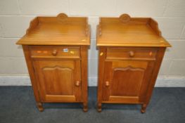 A PAIR OF SATINWOOD BEDSIDE CABINETS, with a raised back, single drawer and door, width 53cm x depth