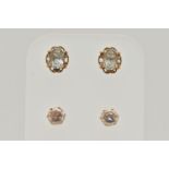 TWO PAIRS OF EAR STUDS, the first designed as an oval blue topaz within a four claw setting with a