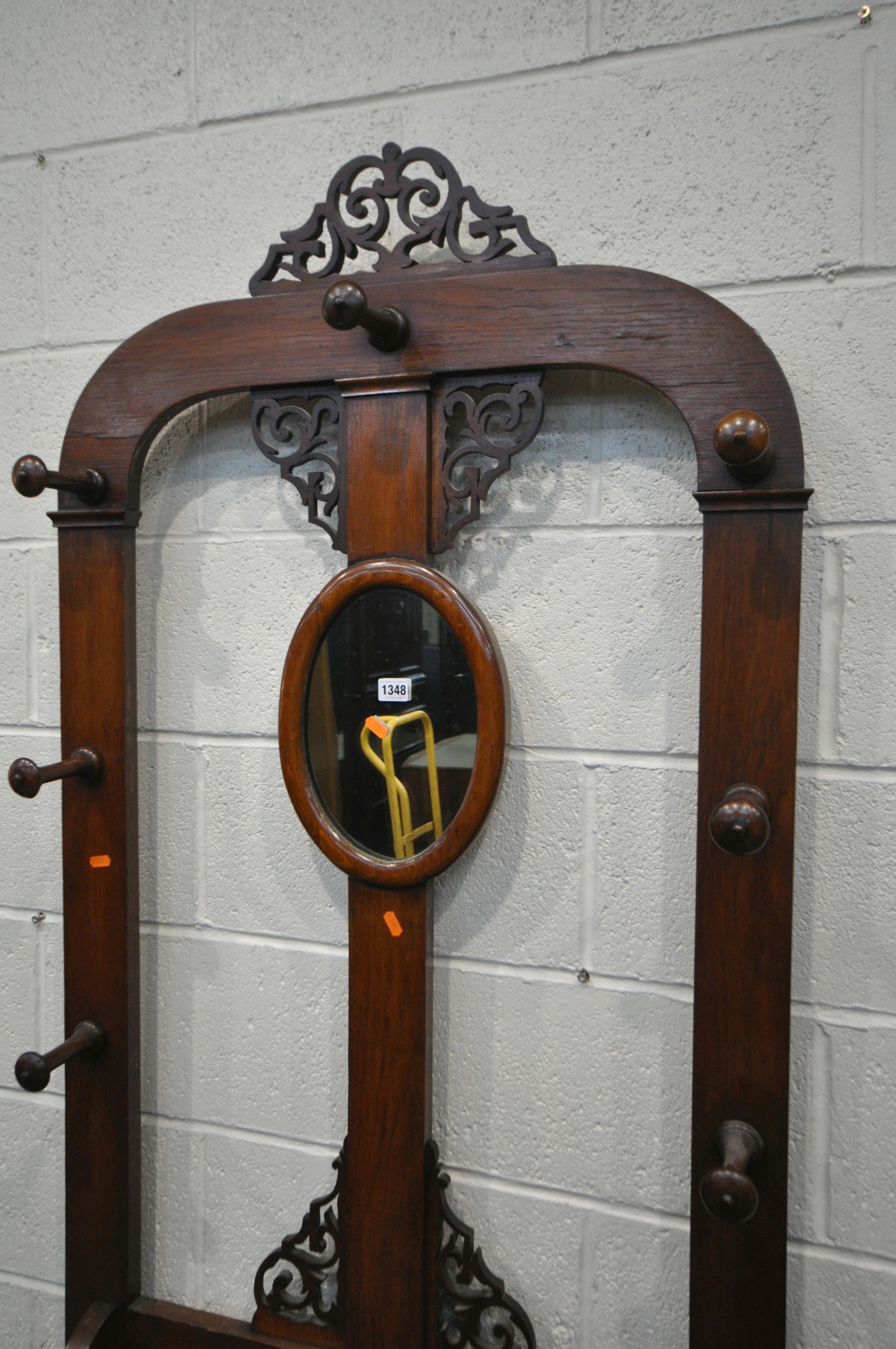 A VICTORIAN WALNUT AND OAK HALL STAND, with open fretwork detail, an arrangement of ten hooks, - Image 2 of 3