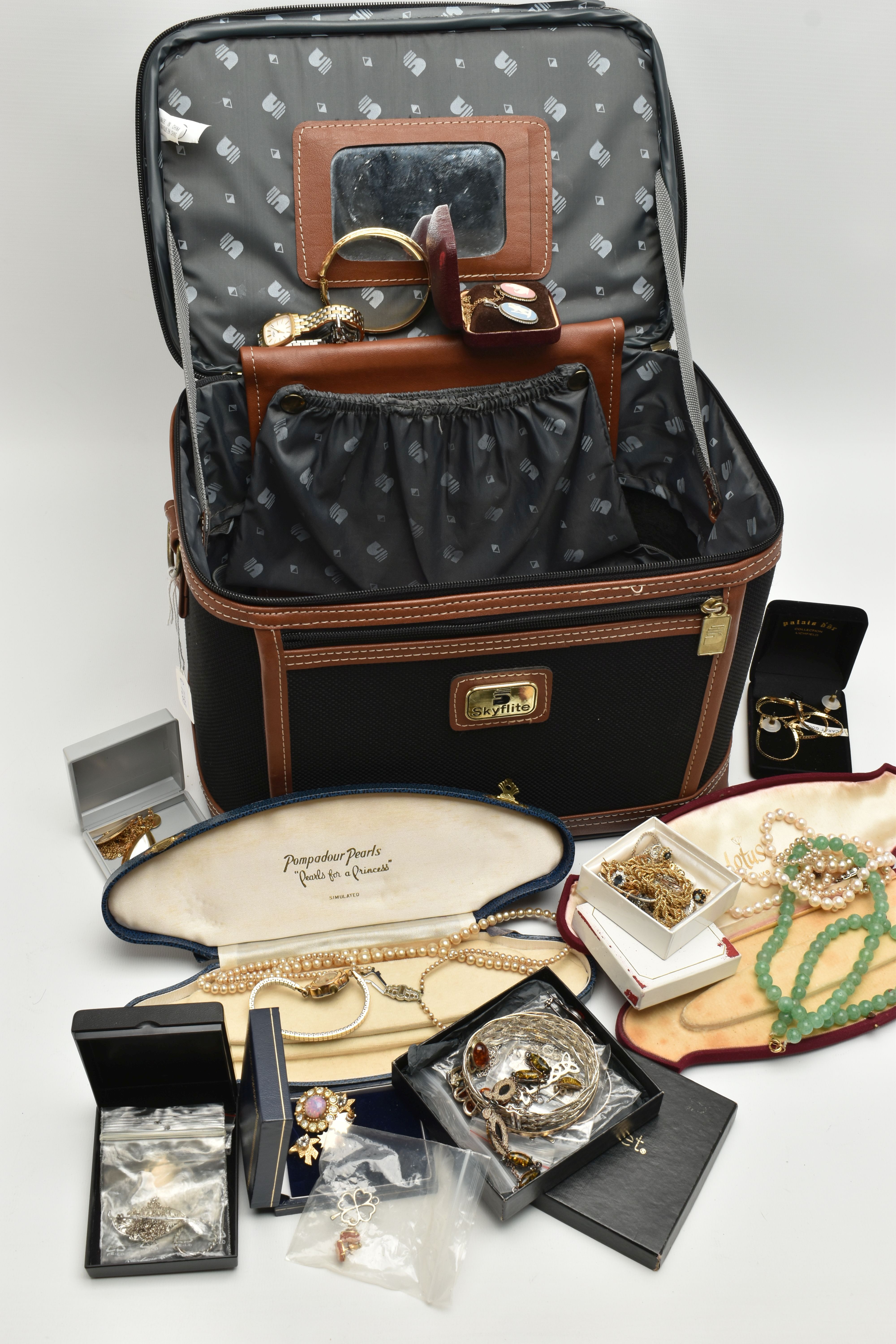 A TRAVEL CASE WITH COSTUME JEWELLERY, to include a hinged rolled gold bangle, a crackled quartz