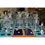 ELEVEN CLEAR GLASS CHEMIST /PHARMACY BOTTLES AND AN INCOMPLETE DRAUGHTSMAN'S SET, seven of the