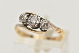 A THREE STONE DIAMOND RING, three round brilliant cut diamonds, prong set in white metal, leading