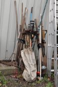 A SELECTION OF GARDEN TOOLS including a set of hickory and brass chimney brushes, rakes, forks,