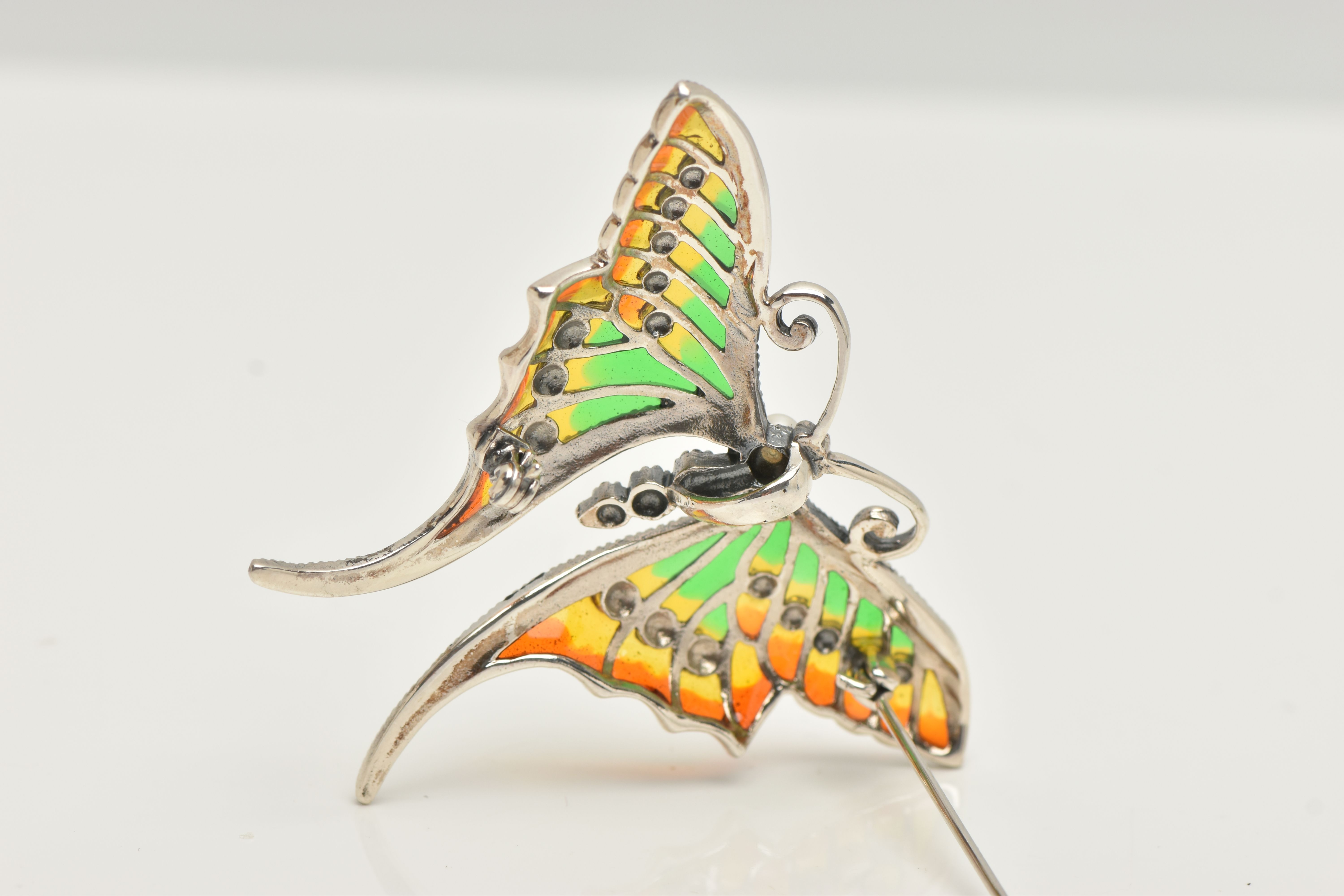 A WHITE METAL PLIQUE A JOUR BROOCH, in the form of butterfly with red, green and yellow enamel - Image 3 of 3