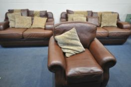 A BROWN LEATHER AND FABRIC THREE PIECE SUITE, comprising a three seater settee, length 216cm x 106cm
