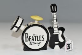 A LORNA BAILEY 'THE BEATLES STORY' SMALL TEA POT IN THE FORMOF A DRUM KIT AND GUITAR, signed to