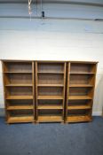 THREE PINE OPEN BOOKCASES, with four shelves each, width 89cm x depth 35cm x height 192cm (condition
