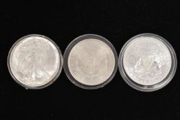 THREE COINS, to include a 2015 Freedom coin, stamped 1 Troy oz .999, a 1987 Liberty one dollar coin,