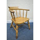 A 19TH CENTURY ELM SMOKERS CAPTAIN CHAIR (condition report: aged wear and tear, frame slightly