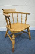 A 19TH CENTURY ELM SMOKERS CAPTAIN CHAIR (condition report: aged wear and tear, frame slightly