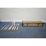 A TOWNSEND CROQUET SET, in a pine case, comprising four mallets, fifteen balls and seven cast iron