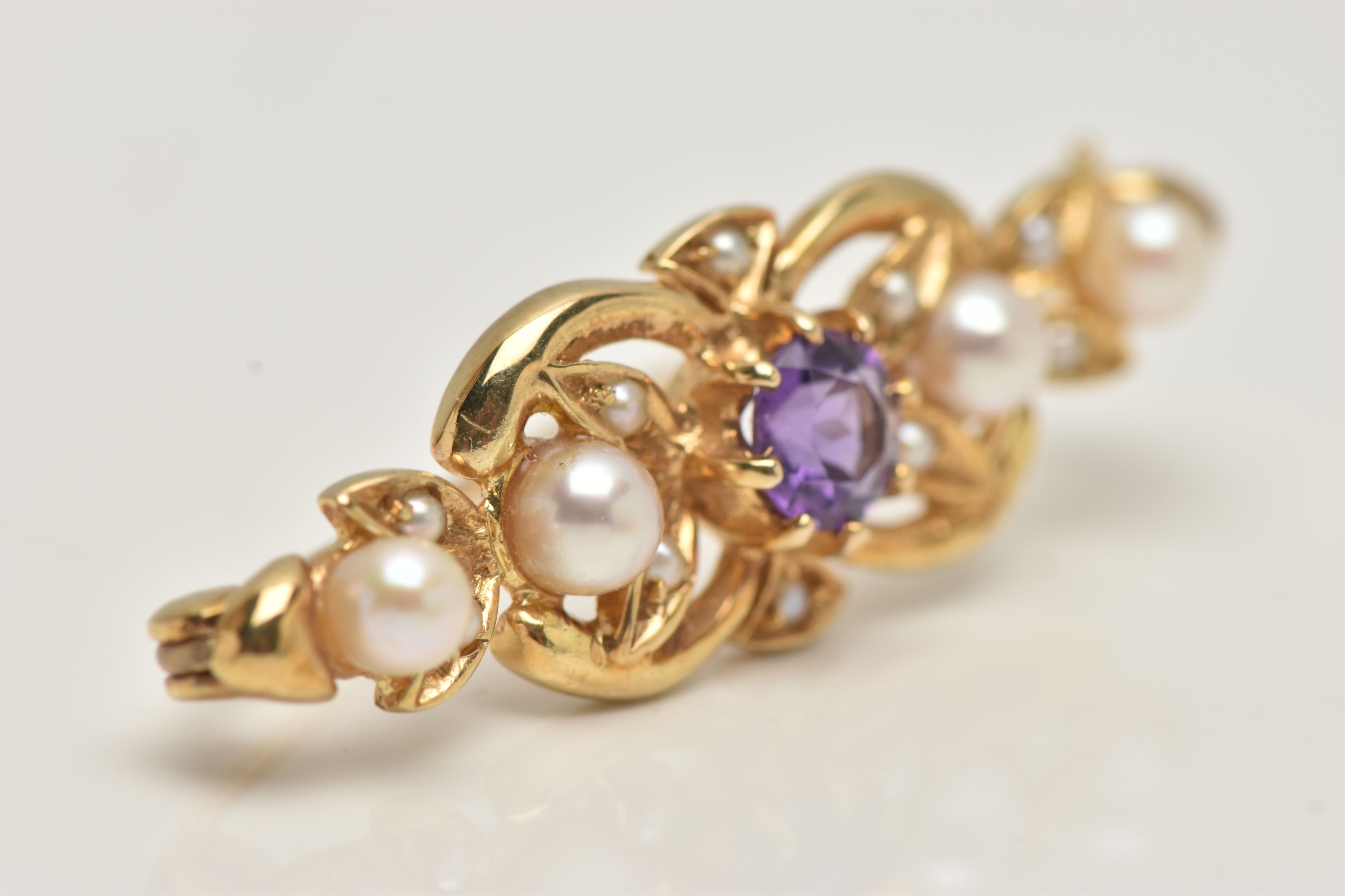 A 9CT GOLD AMETHYST AND SEED PEARL BROOCH, open work brooch set with a central circular cut - Image 2 of 4
