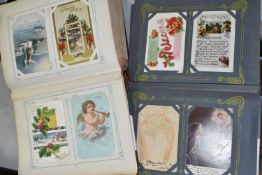 TWO ALBUMS OF POSTCARDS containing approximately 504 'Greetings' type Postcards from the UK,