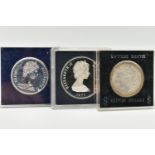 THREE CASED COINS, to include a 1977 Elizabeth II Turkes and Caicos Island 20 Crowns coin, a