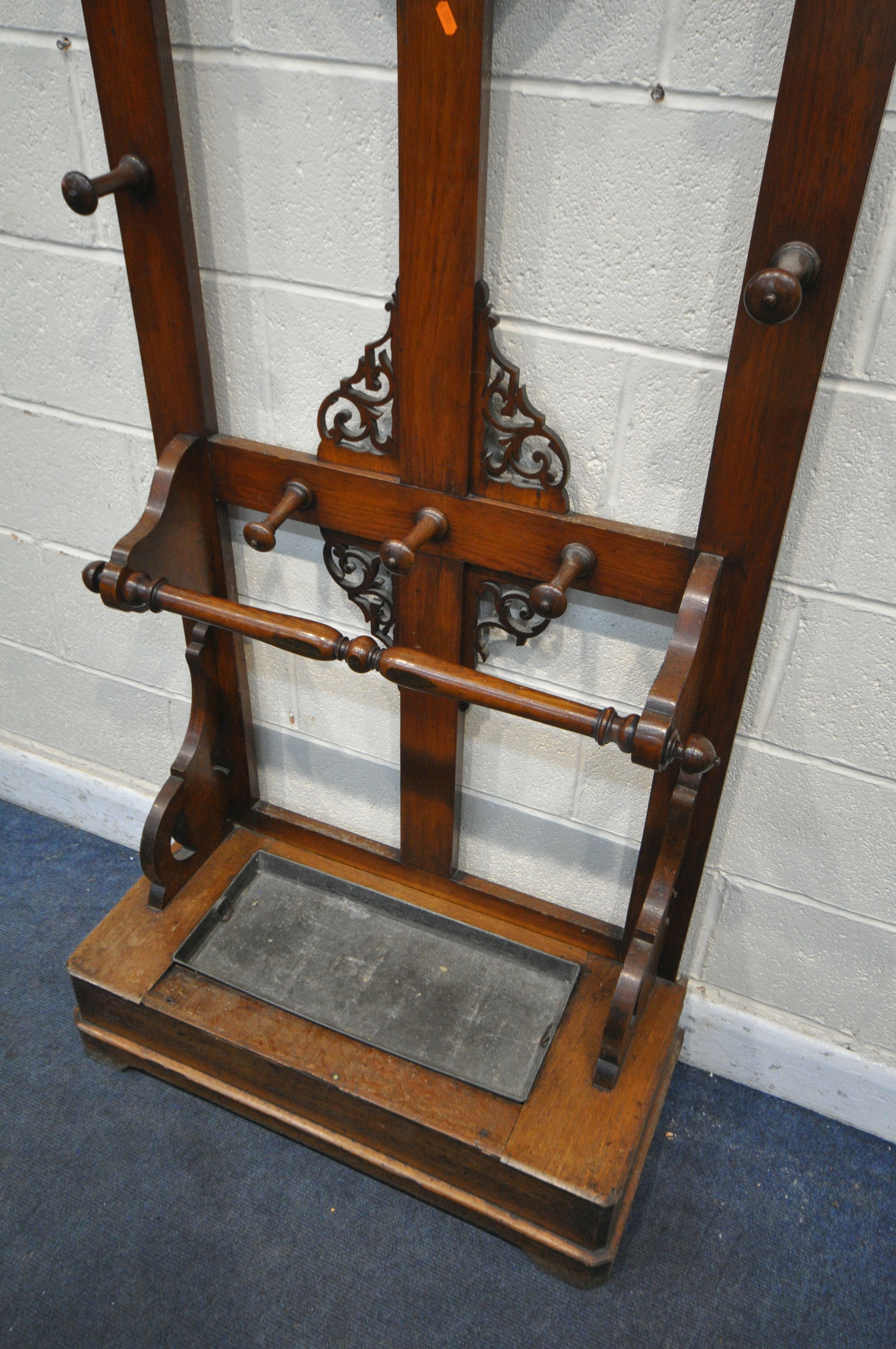 A VICTORIAN WALNUT AND OAK HALL STAND, with open fretwork detail, an arrangement of ten hooks, - Image 3 of 3
