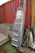 A SET OF ALUMINIUM DOUBLE EXTENSION LADDERS with thirteen rungs to each 350cm section along with