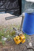 A LEE HOWL PETROL WATER PUMP with a Briggs and Stratton engine (pulls freely but hasn't started) and