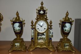 A MODERN ITALIAN 'IMPERIAL' BRASS AND PORCELAIN CLOCK GARNITURE, the finials, columns and front