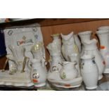 A COLLECTION OF BELLEEK AND DONEGAL CHINA, nineteen pieces, of which thirteen are Belleek -