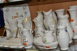 A COLLECTION OF BELLEEK AND DONEGAL CHINA, nineteen pieces, of which thirteen are Belleek -
