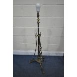 AN EARLY 20TH CENTURY BRASS TELESCOPIC LAMP, on tripod legs, min height to fitting 120cm (